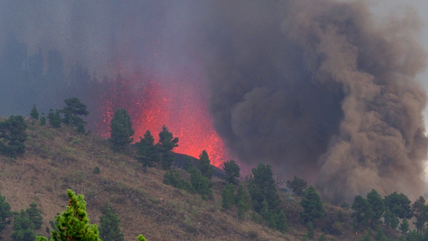 Mount Cumbre Vieja erupts spewing a column of smoke, ash and lava