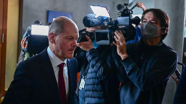Olaf Scholz pictured as he left the committee meeting