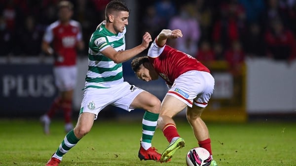 Dylan Watts of Shamrock Rovers in action against Matty Smith