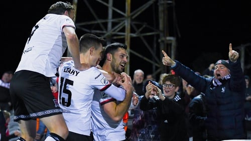 Patrick Hoban celebrates with fans and teammates after scoring his side's second goal