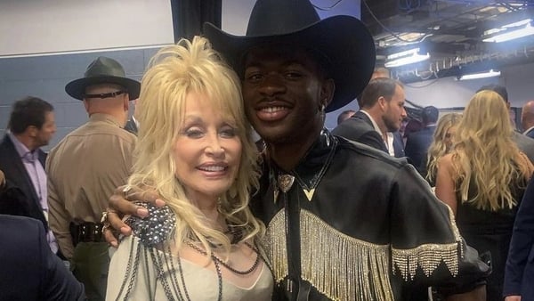 Dolly Parton and Lil Nas X pictured at the CMA Awards, image via DollyParton/Instagram