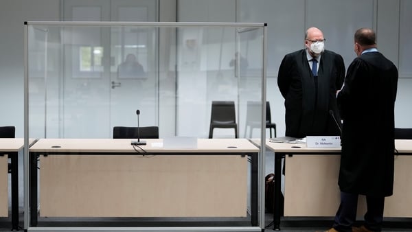 Two lawyers stand in court where Irmgard Furchner was due to stand trial
