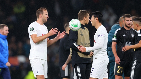 Son Heung-min presents Harry Kane with the matchball after his hat-trick against Mura