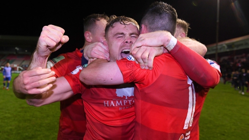 Georgie Poynton celebrating with teammates after Shelbourne seal promotion