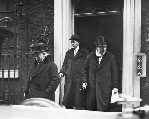 Winston Churchill emerging from a building