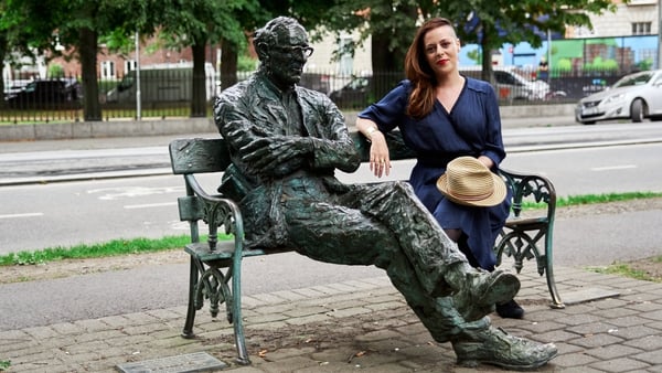 Annemarie Ní Churreáín with the statue of Patrick Kavanagh by Dublin's Grand Canal (Pic: Enda Rowan)