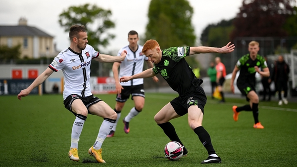 Rory Gaffney in action against Cameron Dummigan in the Oriel Park meeting in May
