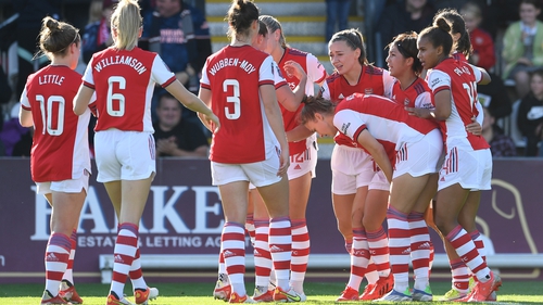 Katie McCabe celebrates scoring Arsenal's opening goal with her team mates