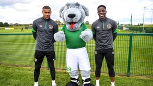 Gavin Bazunu and Chiedozie Ogbebe pose with Ireland mascot Macúl after returning from Azerbaijan