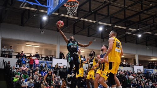 Aaron Calixte of Garvey's Tralee Warriors goes up for a basket against Team 360 Financial Killorglin