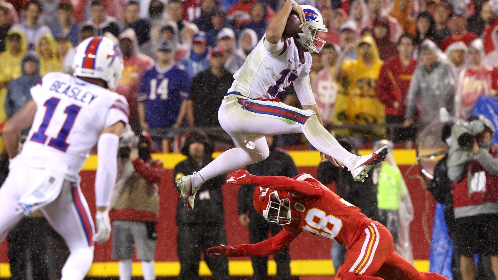 Buffalo Bills quarterback Josh Allen (17) hurdles Minnesota