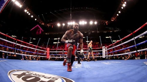 Tyson Fury knocks down Deontay Wilder in the third round during their WBC heavyweight championship