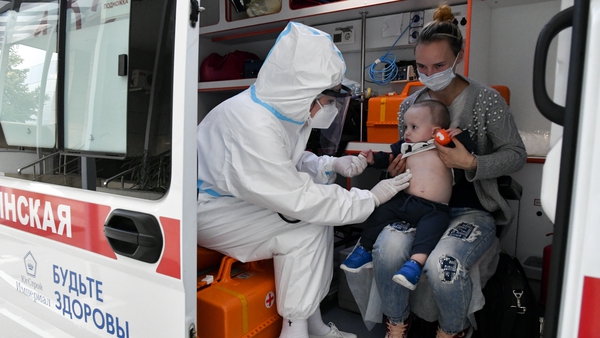 A medical worker admits a child to a Covid-19 facility of Krasnodar's Children's Infectious Diseases Hospital