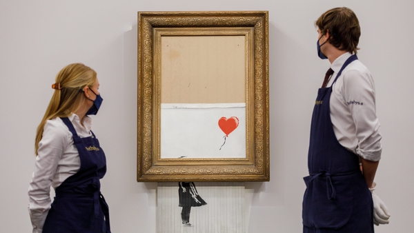 A picture by British artist Banksy made £18.6m when it went back under the hammer for a second time in London