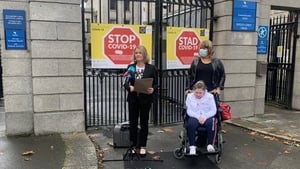 Caitlin Twomey and her mother Michelle watch solicitor Anne Marie Donnelly read a statement welcoming the €8m interim settlement