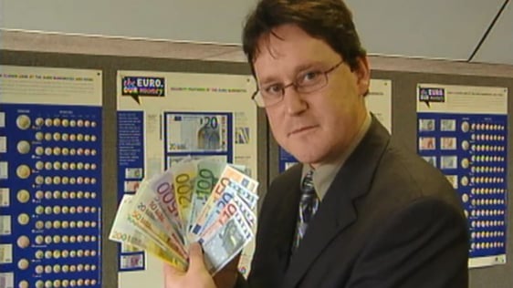 George Lee holds euro notes for the first time, 2001.