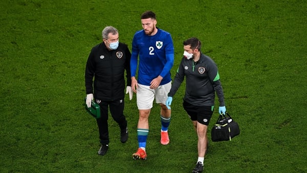 Matt Doherty leaves the pitch with an injury against Qatar