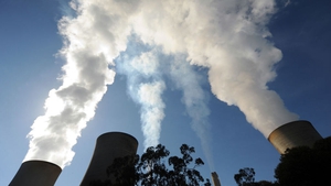 Steam billows from the cooling towers of a coal-fired power station in Australia