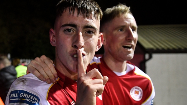 Darragh Burns (L) celebrates with Ian Bermingham after scoring St Pat's third goal