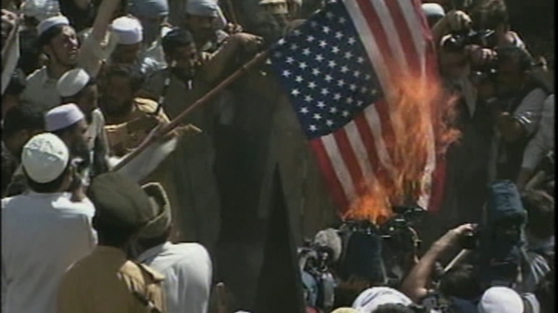 A US flag is burned at a protest in Pakistan