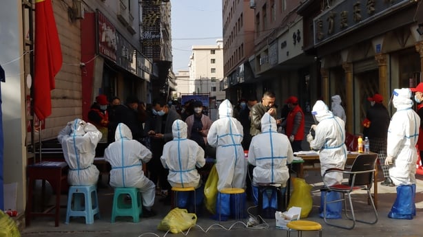 Residents queue up for Covid tests at a temporary site in Zhangye as cases rise across China