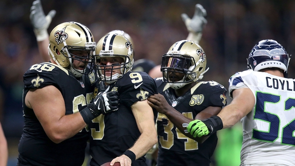 Drew Brees (9) reacts with Tim Lelito (68) after scoring Saints' second quarter touchdown