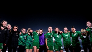 Katie McCabe and her Republic of Ireland team-mates huddle together after the win in Helsinki