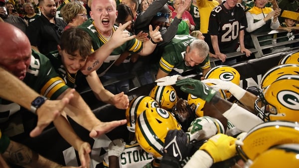 Green Bay's Rasul Douglas (29) is congratulated by team-mates and fans following a fourth quarter interception