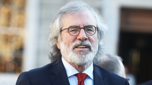 An apology to Gerry Adams was read out in the High Court