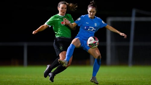 Ciara Maher of DLR Waves in action against Lucy McCartan of Peamount United