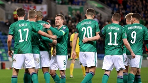 Northern Ireland players celebrate after Benas Satkus own goal