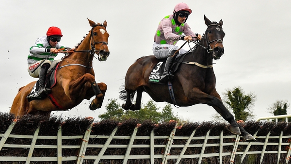 Sharjah (R) with Patrick Mullins up, jumps the last on their way to winning