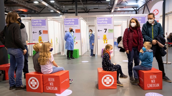 Children wait in line to receive their Covid-19 vaccine in Vienna, Austria
