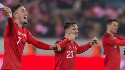 Switzerland players Andi Zeqiri and Xherdan Shaqiri celebrate qualification