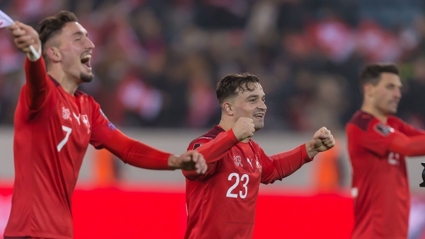 Switzerland players Andi Zeqiri and Xherdan Shaqiri celebrate qualification