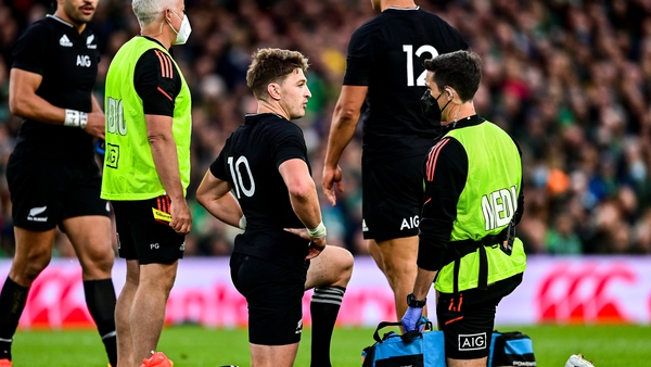Beauden Barrett receives attention before leaving the pitch against Ireland for a HIA