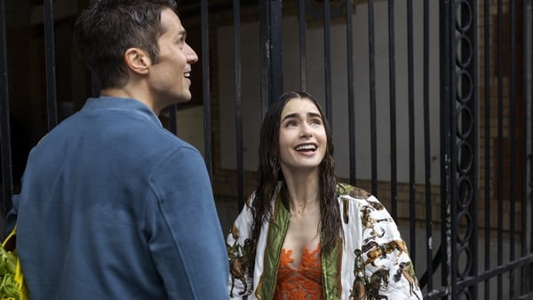 Lucas Bravo as Gabriel and Lily Collins as Emily in season two