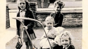 Walsh siblings Callie, Anthony and Joseph in the pram, with author Suzanne at the front