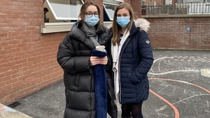 Teacher Rachel Foyle, wearing a long hot water bottle, pictured alongside her colleague Hazel 
O'Connell at St Catherine's National School in Dublin