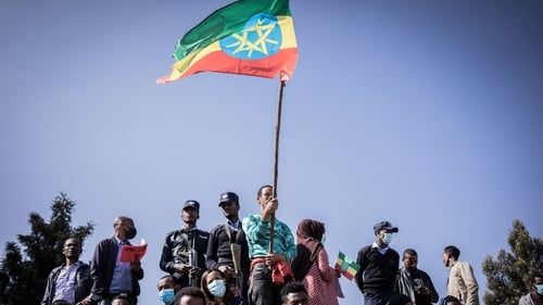 A man holds the Ethiopian national flag at a ceremony for new military recruits (File photo)