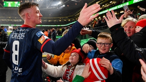 Chris Forrester celebrates with fans after the game