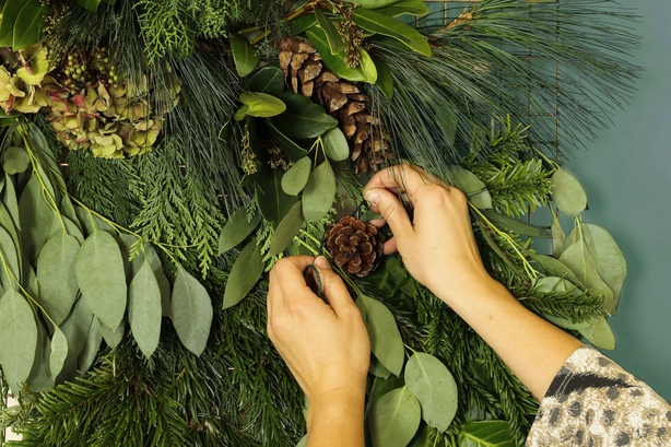 Add extra interest such as pine cones to the tapestry (Dobbies Garden Centres/PA)