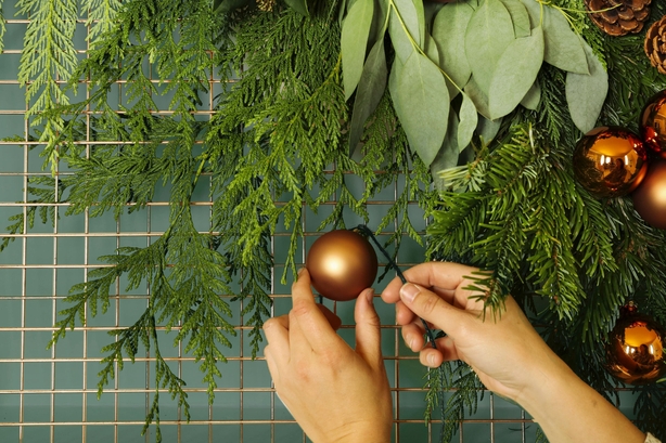 Using baubles adds colour (Dobbies Garden Centres/PA)