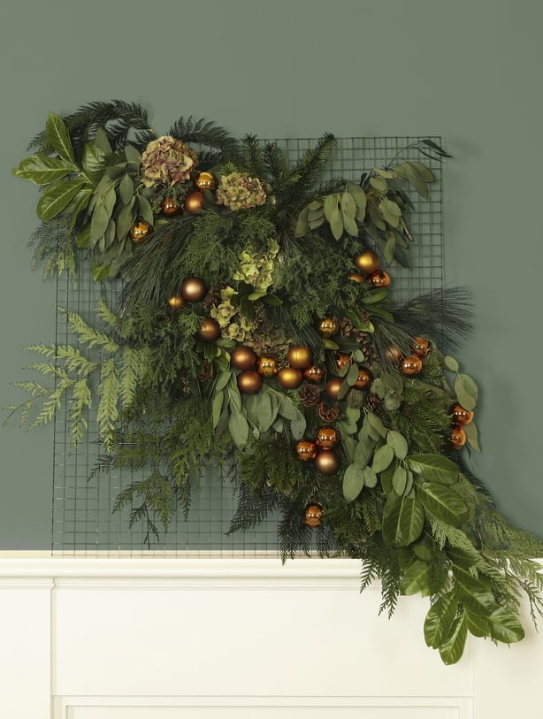 A finished festive floral tapestry (Dobbies Garden Centres/PA)