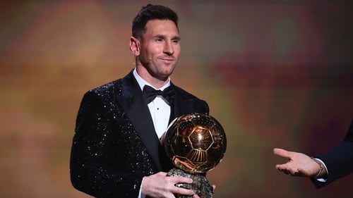 Messi poses after being awarded the Ballon d'Or