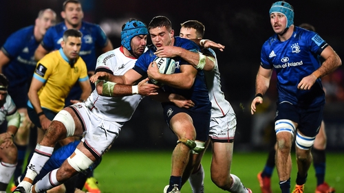Leinster's Scott Penny is tackled by Mick Kearney, left, and Stuart McCloskey of Ulster
