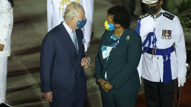 Prince Charles is greeted by Sandra Mason as he arrives at Bridgetown Airport in Barbados
