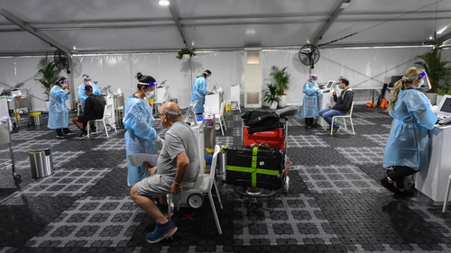 Passengers undergo Covid-19 tests at the Histopath Diagnostic Specialists pre-departure area at Sydney International Airport