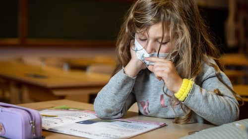A six-year-old pupil adheres to the new mask mandate in Ghent, Belgium