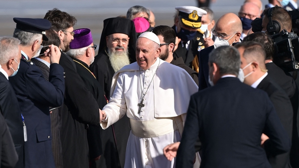 Pope Francis is greeted as he arrives in Athens